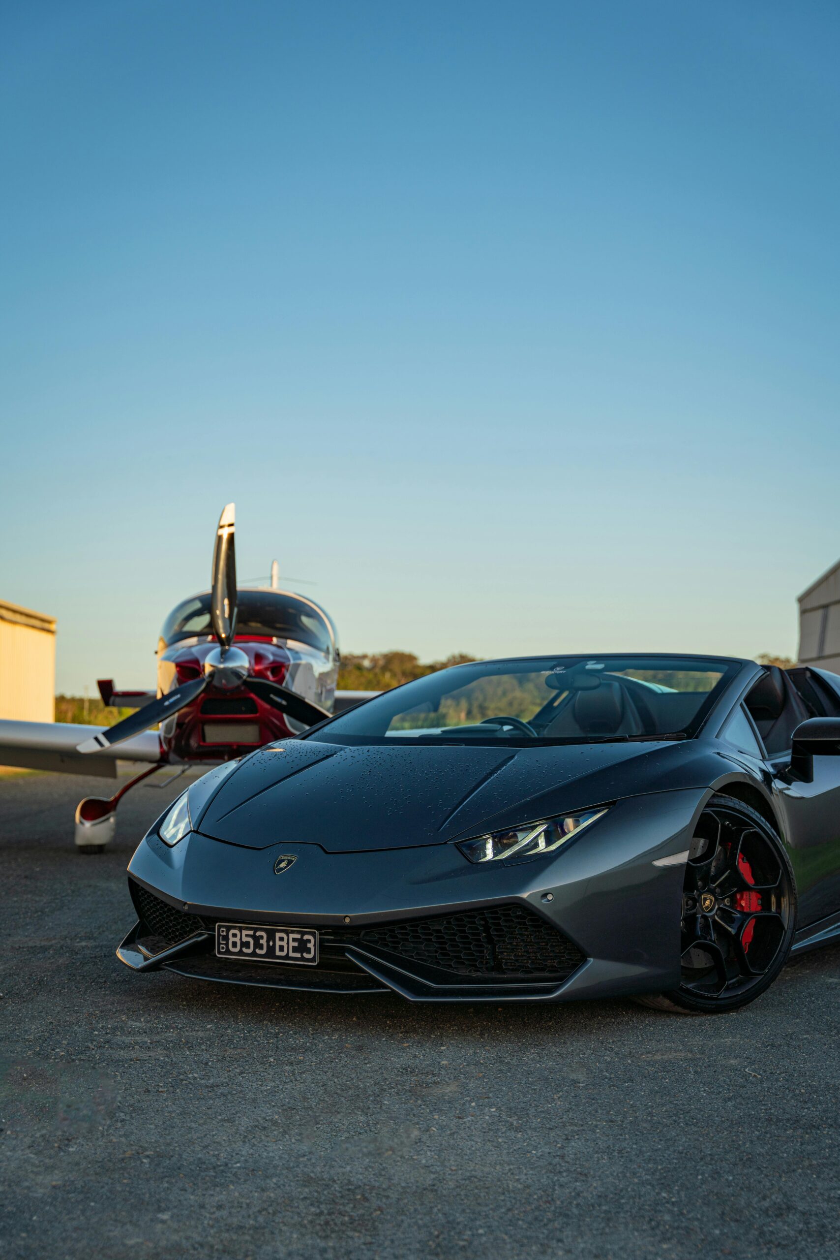 Luxury Lamborghini Huracan and private plane at Gold Coast Airport, QLD, Australia.
